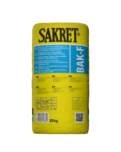 SAKRET BAK-F reinforcing mortar being applied to stone wool insulation in low-temperature conditions.
