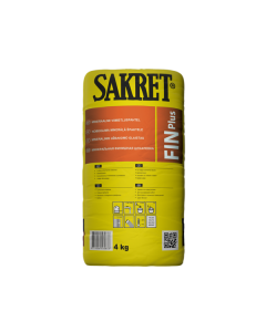 White SAKRET lime-cement finishing filler being applied to a mineral wall with a spatula to create a smooth, paint-ready surface.