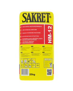 SAKRET HM 12 lime-cement plaster being applied to a historic brick masonry wall, showing its fiber-reinforced texture designed for restoration projects.