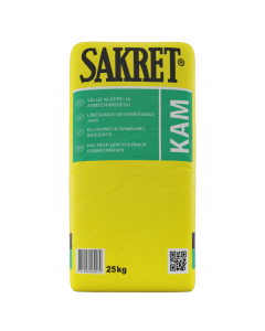 White SAKRET KAM adhesive being applied to a mineral wool insulation board, showing the reinforcement layer with embedded mesh for a high-durability ETICS facade.