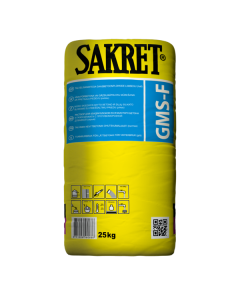 Professional masonry work using SAKRET GMS-F winter-grade mortar for aerated concrete blocks, showing the precise application of frost-resistant adhesive in sub-zero conditions.